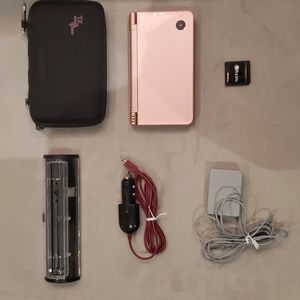 Nintendo DSi XL Pink in color in perfect working order.